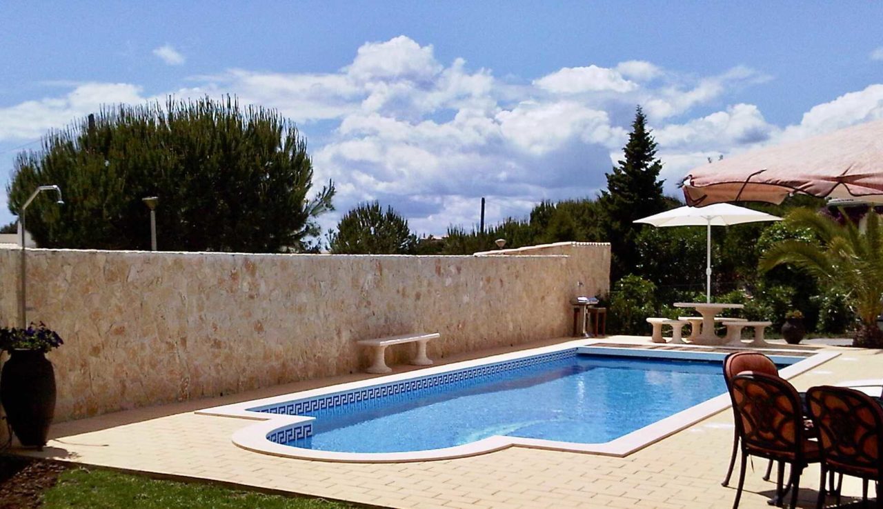 Pool with stone wall